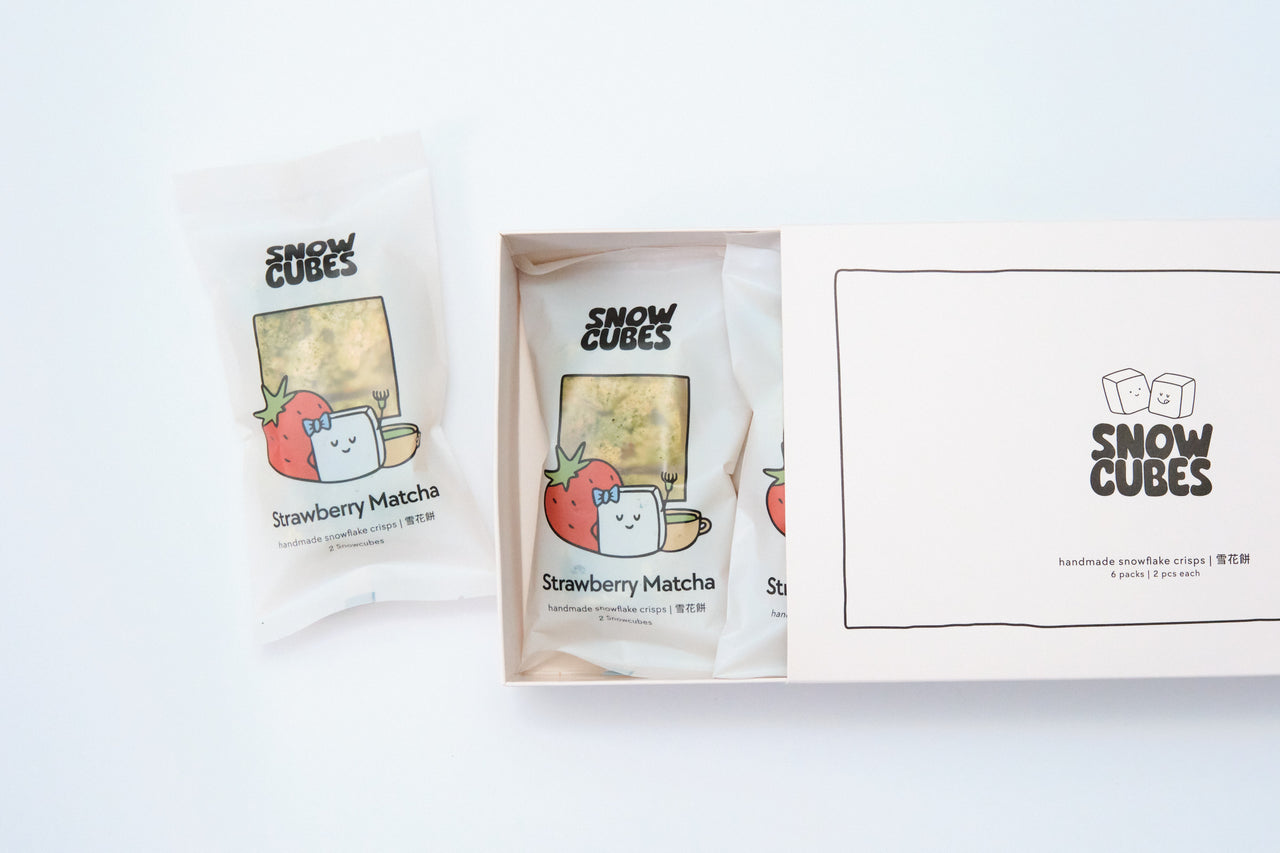 Strawberry Matcha Snowcubes — handmade Taiwanese snowflake crisps with freeze-dried strawberries and ceremonial-grade matcha, boxed with two pouches