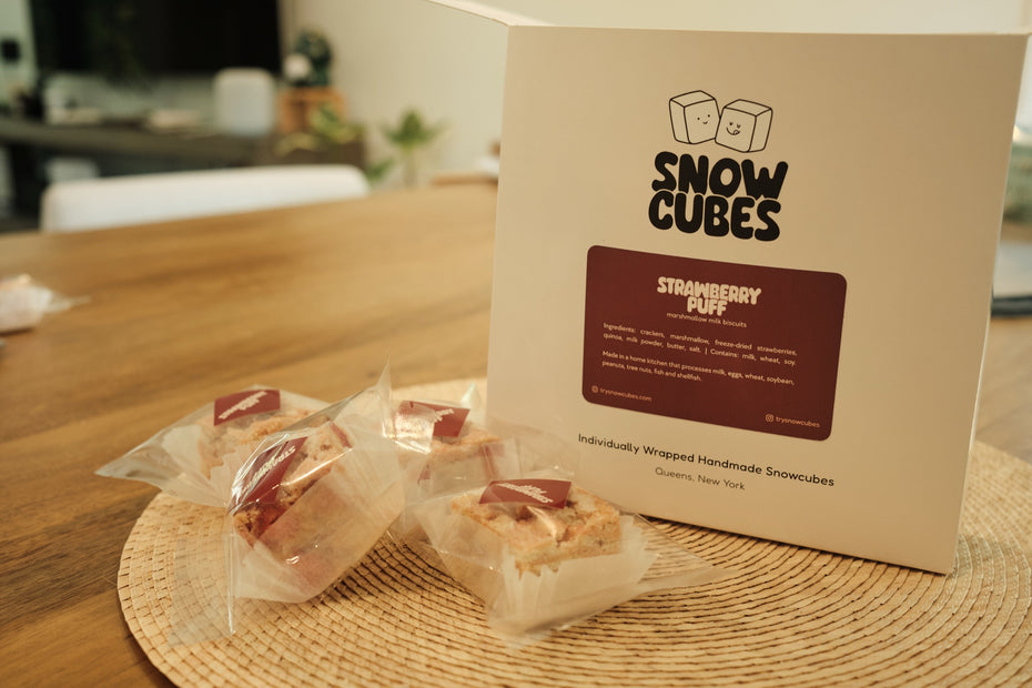 Strawberry Puff Snowcubes — 24-piece box with individually wrapped pieces on the kitchen table