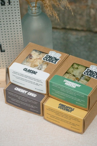 四盒 Snowcubes 口味礼盒，标示 Classic、Strawberry Matcha、Cherry Oreo 和 Pineapple Coconut